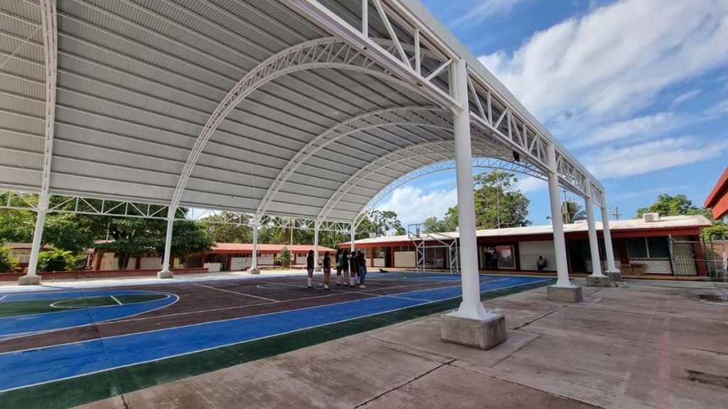 a basketball court with people around it