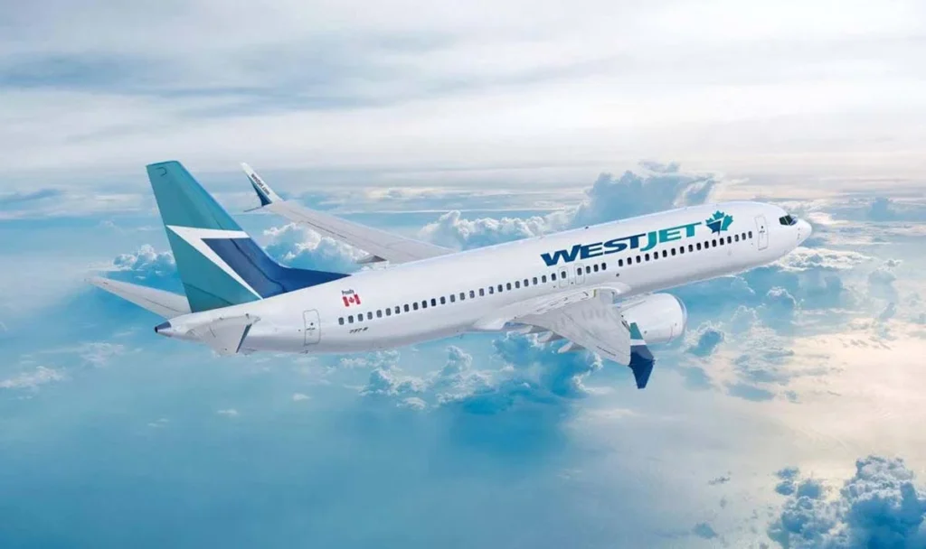 Un avión de WestJet en el aire.
